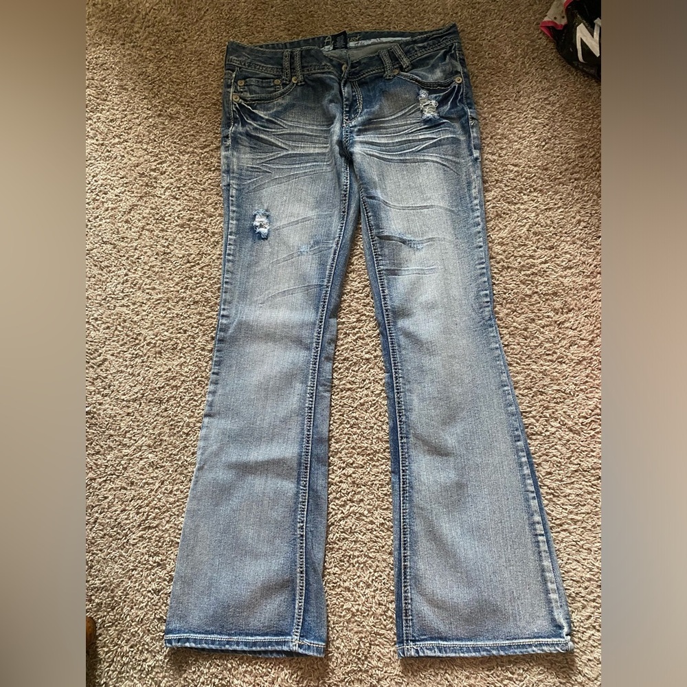Size 11 Amethyst light/medium wash denim flare jeans.